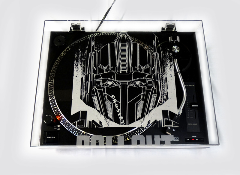 Illustration for article titled Win this exclusive Optimus Prime Crosley Turntable and the new Transformers Roll Out vinyl